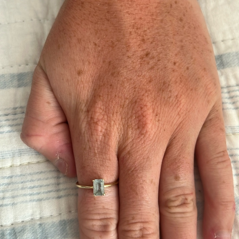 This is a 14K yellow gold Aquamarine stone ring in a size 6!